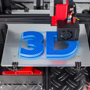 Red black 3D printer printing blue logo symbol on metal diamond plate future technology modern concept background